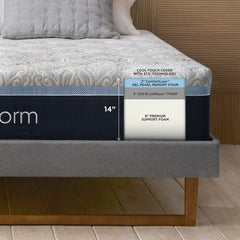 Close up view of the front corner of the Serafina Mattress with a height marker measuring 14 inches in total next to a revealed breakdown of the mattress layers labeled "Cool touch cover with 37.5® Technology, 2 Inch ComfortLuxe gel pearl memory foam, 3 Inch solid LURAcor foam, and 9 Inch premium support foam"