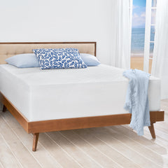 Side of front view of a bed with the ComfortLuxe Topper slip cover pulled completely over the mattress