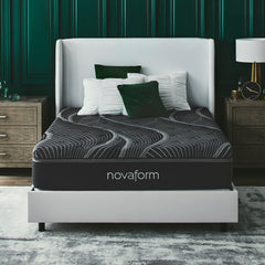 Front view of the Novaform Noir Luxury Uplifting Support Foam Mattress complete with green and white pillows