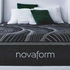Close up front view of the Noir Luxury Mattress with the Novaform logo knit onto the dark gray mattress cover side