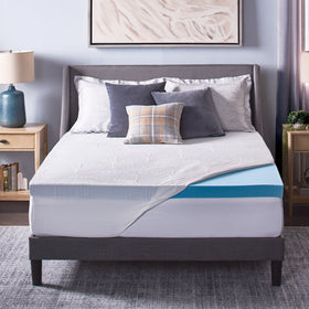 Novaform ComfortLuxe Plus Mattress Topper placed on a mattress with the knit cover pulled back to reveal one corner of the gel memory foam topper. 