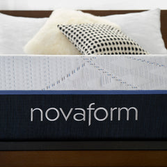Close up view of the Novaform logo knit into the charcoal base cover of the SoFresh mattress with royal blue detailing on the zipper