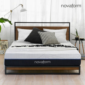 Front view of the Novaform SoFresh Gel Memory Foam Mattress complete with black and white pillows and a throw blanket