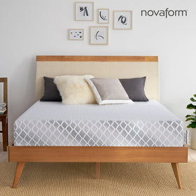 Front view of the Novaform Advanced Back Support 12 Inch Mattress complete with gray and ivory pillows