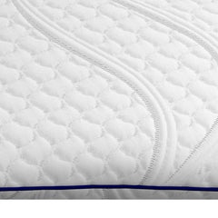 Close view of the ComfortGrande Pillow cover with cooling fibers quilted into the patterned design and a navy stripe running along the side