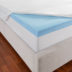 Close view of the mattress topper slip cover pulled back to reveal a corner of the 3 inch gel memory foam layer